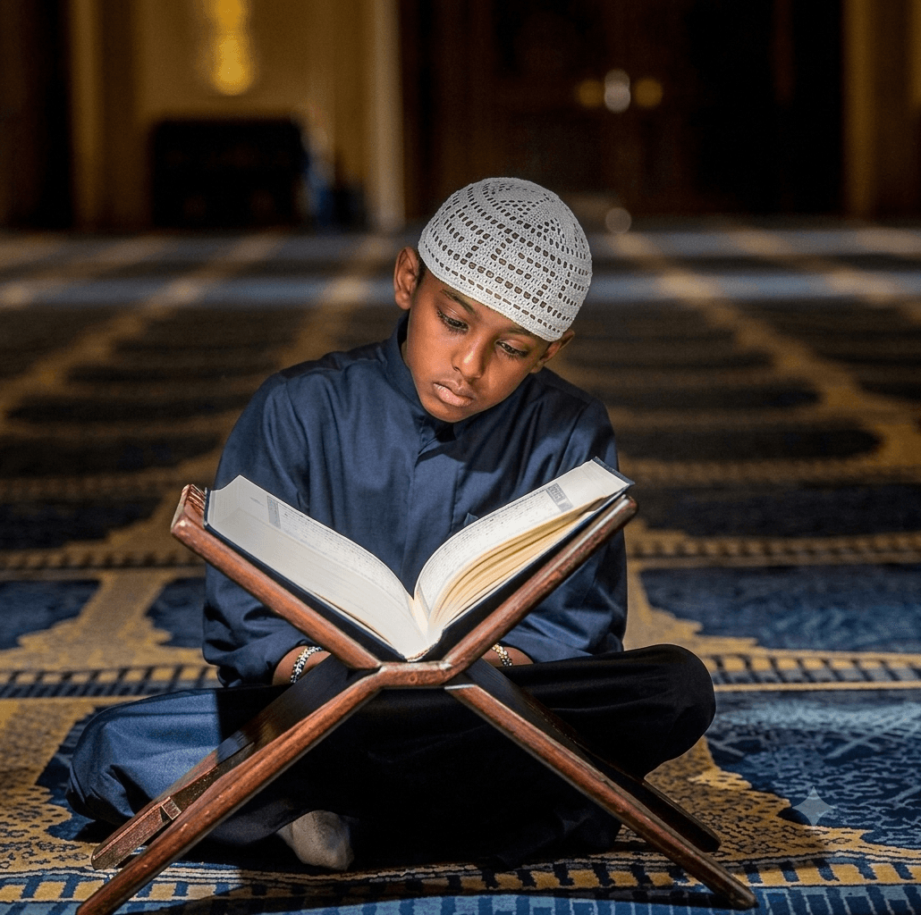 A young student reading from the Quran on a rehal stand